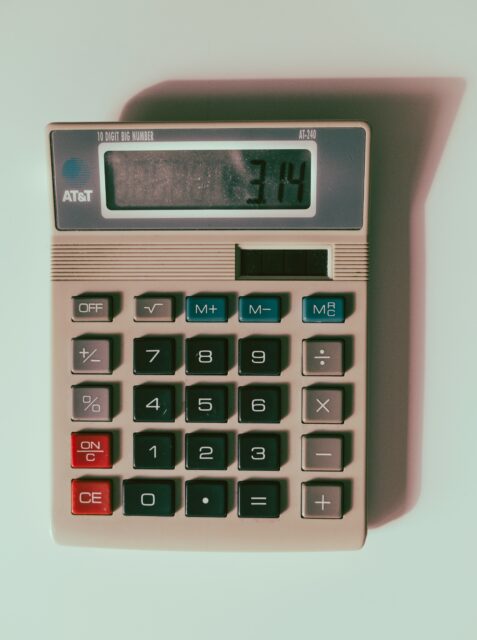 a calculator sitting on top of a white table